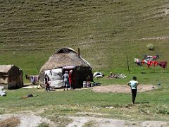 09A Nomads outside their yurt with clothes drying on the line just before Taldyk Pass on the way to Lenin Peak Base Camp